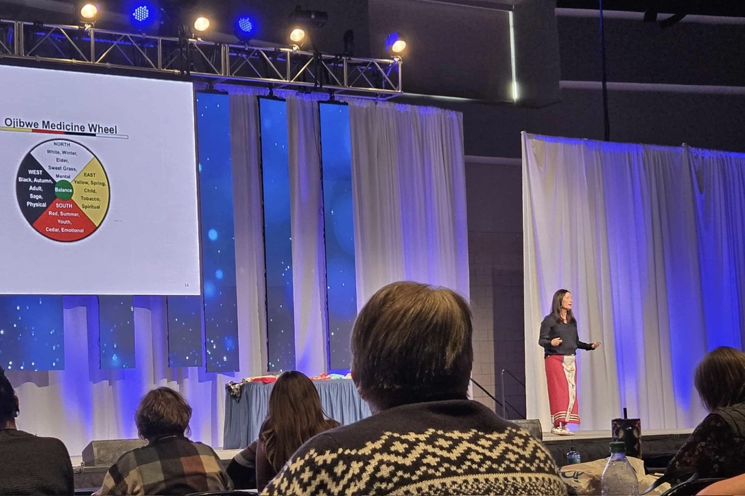 Dr. Julie Smith-Yliniemi presenting on the Ojibwe Medicine Wheel at a conference keynote.